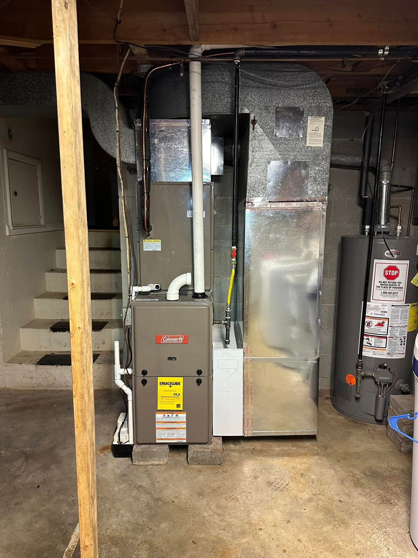 High-efficiency Coleman gas furnace and new sheet metal plenum installed in an Indiana basement