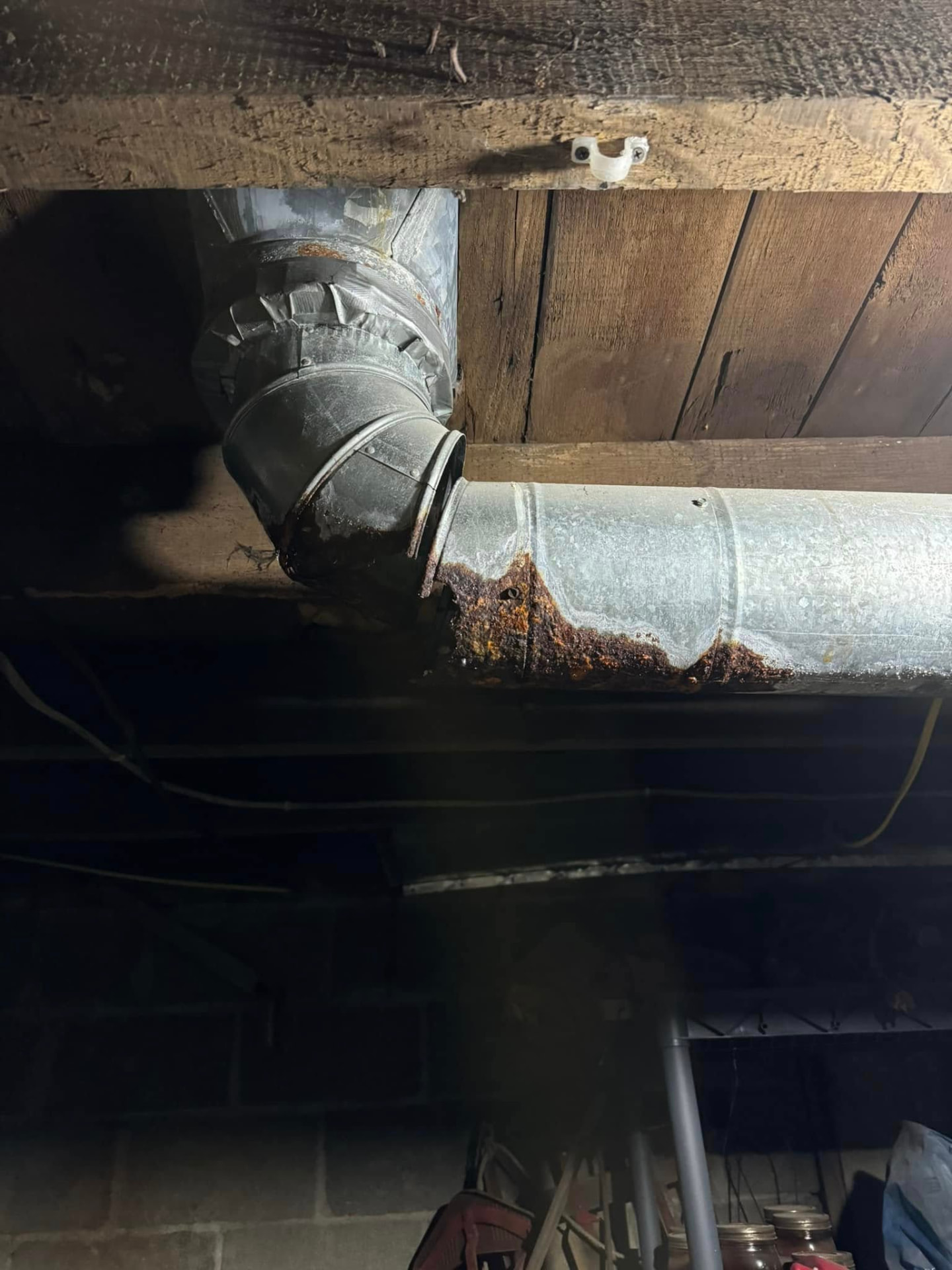 Corroded flue pipe found during an HVAC safety inspection in an older Crawfordsville home